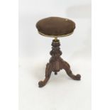 Low walnut height adjustable stool.