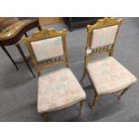 Pair of Italian Neoclassical style gilt hall chairs, with tapered fluted legs, and later reupholster