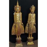 Pair of gilded Asian wooden statues, height of tallest 118cm