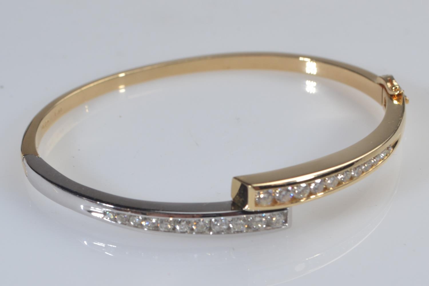 14ct bi-colour gold & diamond hinged bracelet, the diamonds together stated to weigh 1.80 carats, in