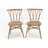 2 Ercol 376 Windsor chairs, in beech & elm. Vintage blue label.