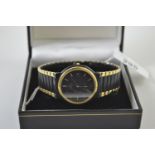 Omega DeVille ladies quartz wristwatch, black face with date aperture, gold coloured dial, on a blac