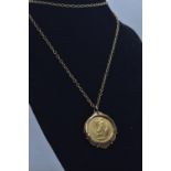 1/10 ounce gold 1996 £10 coin in a 9ct gold mount, with 9ct gold chain, gross weight 7.28 grams