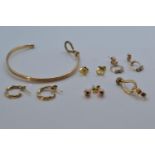 Four pairs of 9ct gold earrings, plus a scrap 9ct gold bangle, gross weight 10 grams