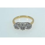 18ct gold triple cluster ring, size L1/2, 3.7 grams