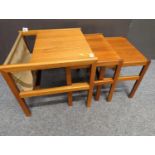Nest of three McIntosh teak tables with canvas magazine storage, largest table W50 x D50 x H45.5cm