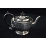 Silver three piece tea service, maker Viner's Ltd, Sheffield 1931, comprising teapot with ebonised h