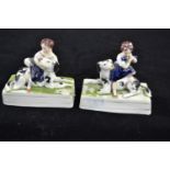 Pair of Staffordshire groups of a child & dog, circa 1850, probably depicting the royal children, ea