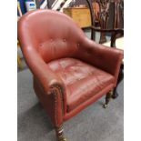 Button back red leather armchair on casters, seat ht 43 cms, full ht 87cms