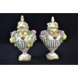 Pair of John Bevington porcelain floral encrusted vases and covers, late 19th century, with gilt ram