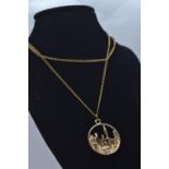 14ct gold pendant depicting New York skyline, with chain, pendant length including bale 28mm, chain