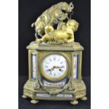 Ornate French gilt and enamel mantle clock topped with a cherub and a ram, key present. Ht 41cms