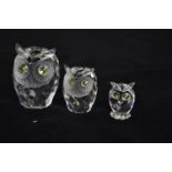 Three Swarovski owl figures, A7636NR060000, A7636NR046000 & A7654NR038000 respectively, with boxes