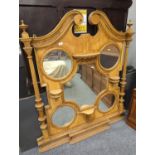 Large stripped pine C19th overmantel unit with 4 circular mirrors and 1 shaped central mirror