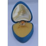 9ct gold ring bezel set with amber coloured stone size N/O gross weight 2grams