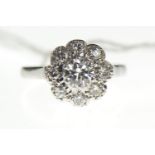 18ct white gold diamond cluster ring, set with nine stones, central stone weight calculated at 0.55