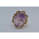 9ct gold ring set with single oval purple stone 15mm x 12mm, size O/P gross, weight 5.2 grams