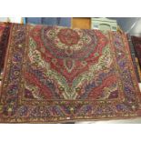 Handmade Persian wool rug, in pink, blue & green tones. 288cm x 210cm