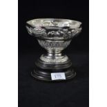 Indian white metal footed bowl, circa 1900, embossed with village scenes, maker's mark to base 'Gris