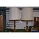 Pair of large brass pedestal table lamps on wooden bases, height inc. shade 81cm, without shade 57.5