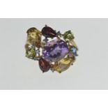 9ct gold & multi stone ring set with amethyst, peridot, citrine, garnet, blue topaz and white stone,