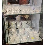 Assorted quality glassware over two shelves, including whisky tumblers with dimples, acid etched liq