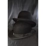 Two bowler hats, one by G. A. Dunn & co. and the other T.B.W ltd.
