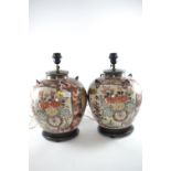 Pair of Japanese ceramic urn vases converted to table lamps, in Imari palette depicting chrysanthemu