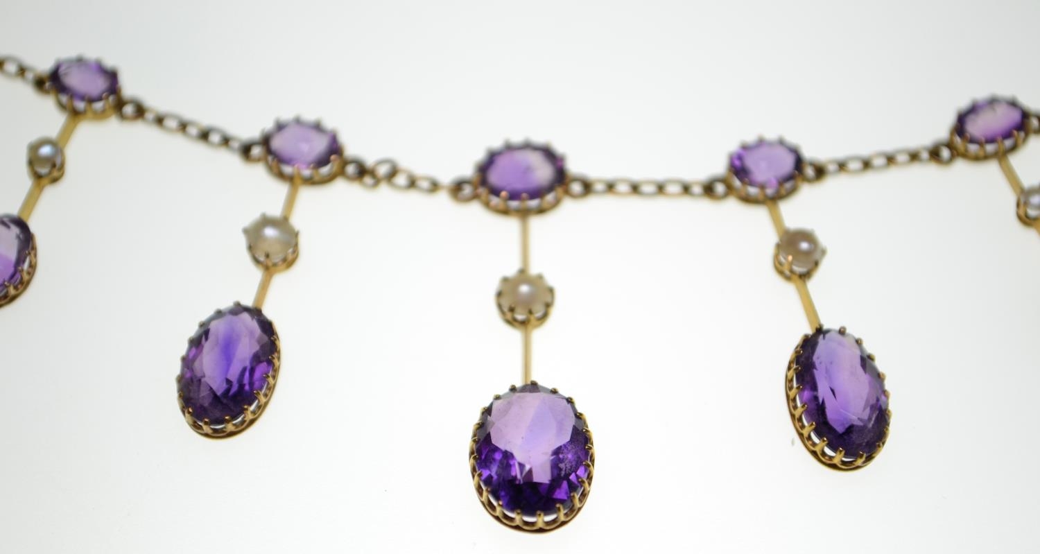 An Edwardian amethyst and half pearl gold fringe necklace, comprising graduating claw-set oval-cut a - Image 3 of 8