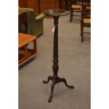 Mahogany fluted jardinière stand. 29cm diameter and height of 103cm
