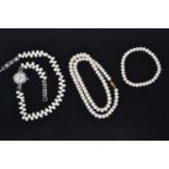 Cultured pearl necklace with a yellow metal clasp, circumference 230mm; a bracelet, approximately 90