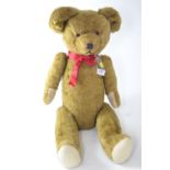 Large early C20th mohair teddy bear, wood wool stuffed with articulated limbs, approx 70cm length