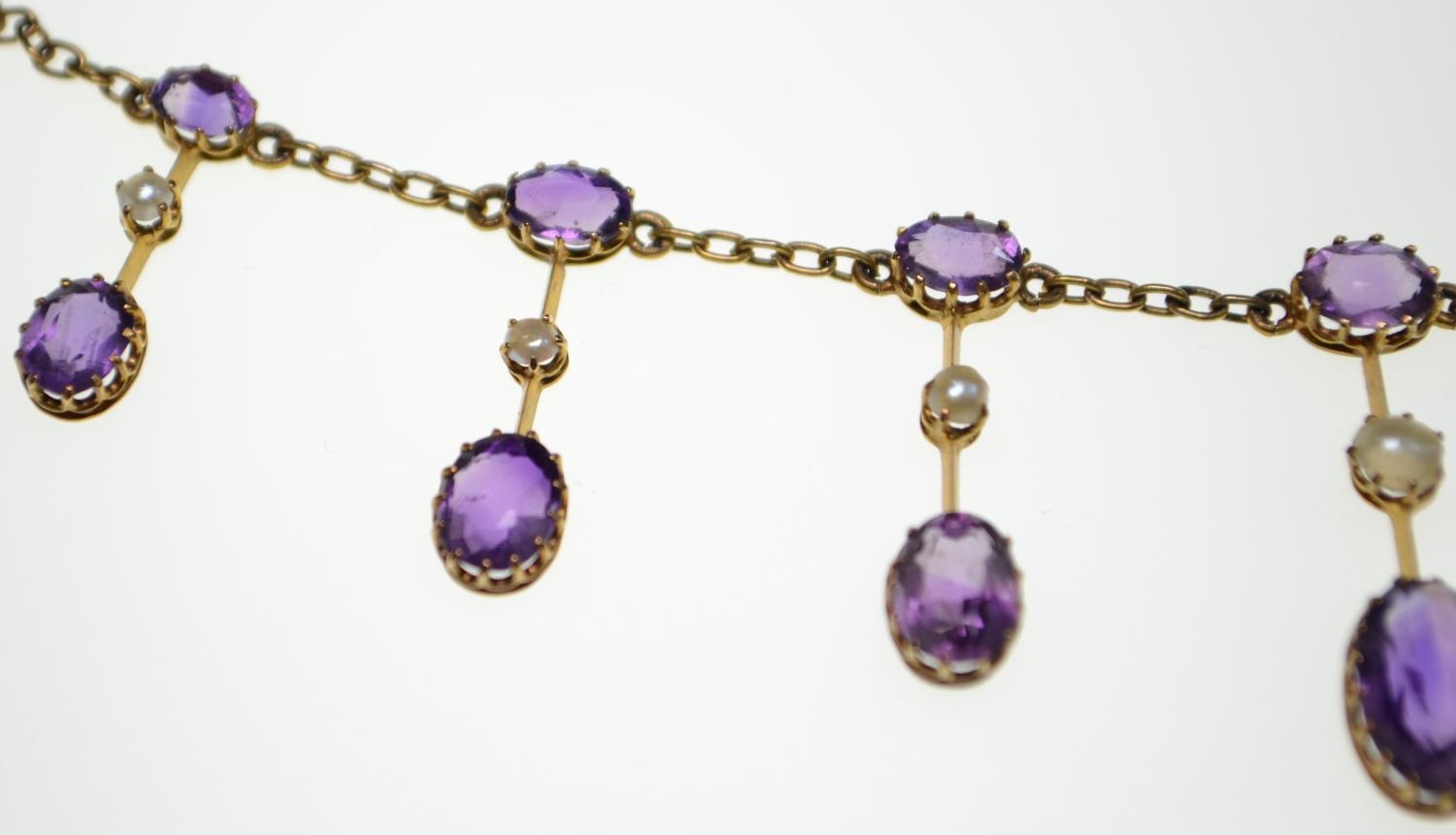 An Edwardian amethyst and half pearl gold fringe necklace, comprising graduating claw-set oval-cut a - Image 5 of 8