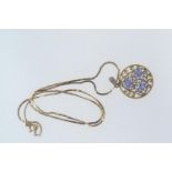 9ct gold, tanzanite & diamond circular open work pendant with a 9ct gold chain, pendant length inclu