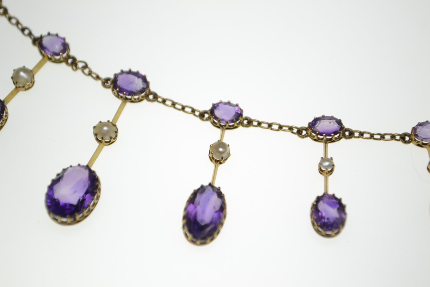 An Edwardian amethyst and half pearl gold fringe necklace, comprising graduating claw-set oval-cut a - Image 7 of 8