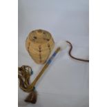 A North American native tribal talking stick, 33cm length, together with an Alaskan Yupik grass lidd