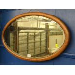 Inlaid bevelled oval mirror, 72 x 42cm