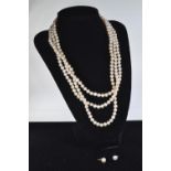 Triple strand cultured pearl necklace with a 14ct gold clasp, pearls measure approximately between 5