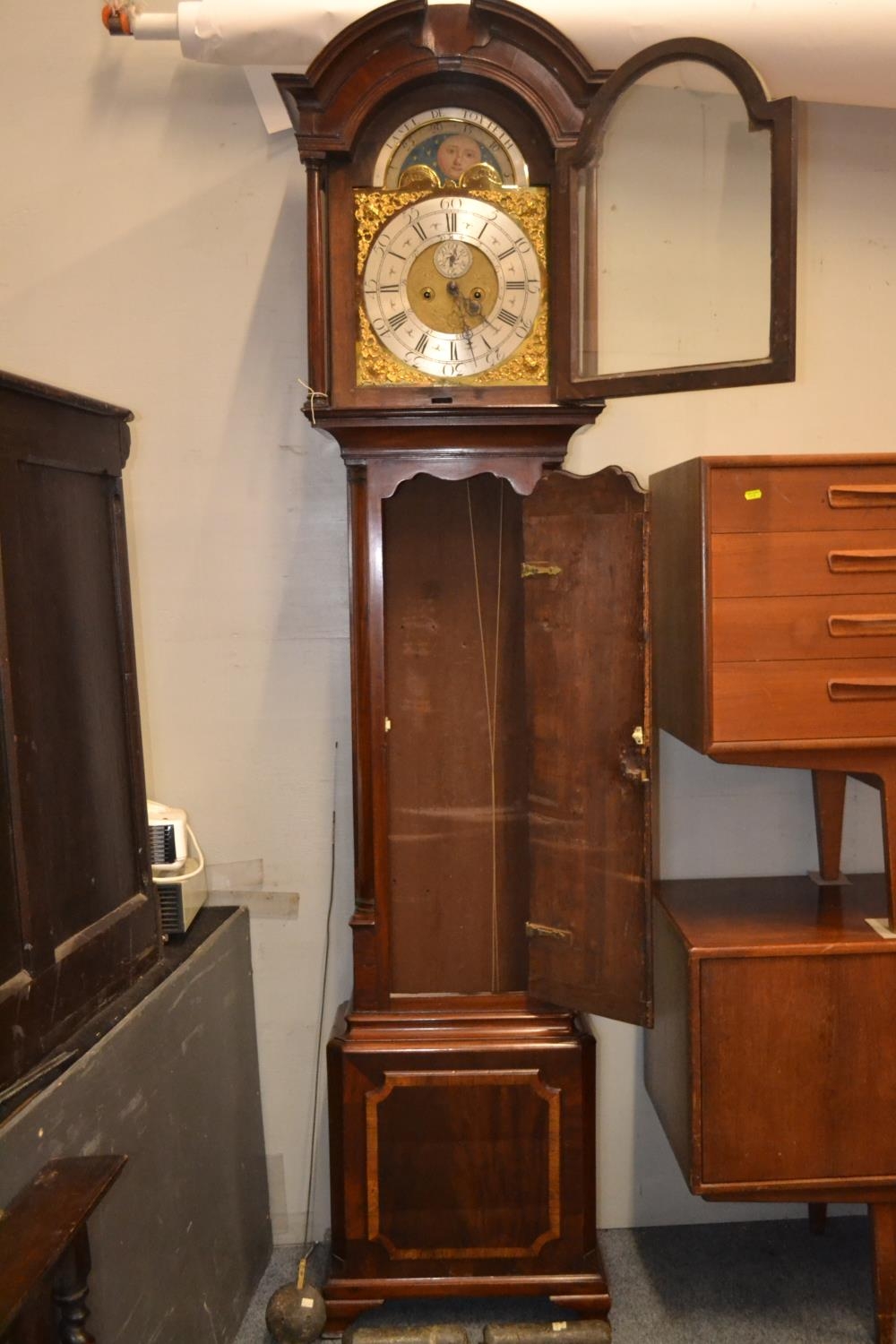 Flame mahogany cased grandfather clock with sun and moon rotating on the face, brass detail. 2 weigh