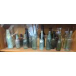 Vintage bottles on shelf inc. Okehampton, Plymouth, Devonport and New York