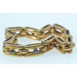 Gold & sapphire bracelet, gold mark rubbed but tests positive for 14ct gold, circumference 180mm, 22
