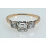 18ct gold, platinum & emerald-cut diamond trilogy ring, the centre stone weighing approximately 0.50