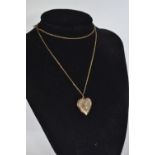 9ct gold heart-shaped locket, 3.9 grams, & a yellow metal chain, 2.8 grams