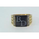 Yellow metal, onyx & diamond signet ring, initialled 'BD', tests positive for 9ct gold, size T, 11.1