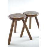 Pair of oak three-legged stools, dia. of seat 25cm x H37cm