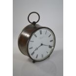 French V.A.P Brevete drum clock retailed by P. Ore & sons Madras, with key, dia. 9.5cm