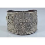 Native American Navajo white metal cuff, the front with applied native American chief flanked by a n