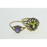 Two 9ct gold & gem set rings, set with a green & purple stone respectively, size N1/2, gross weight