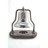 A Mid-C20 Fire Engine Bell, with chrome finish on brass frame, mounted on wooden stand. Bell D25.5cm