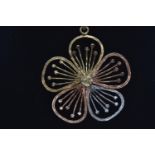 9ct tri-colour gold open work flower pendant with a 10ct gold chain, pendant length including bale 3